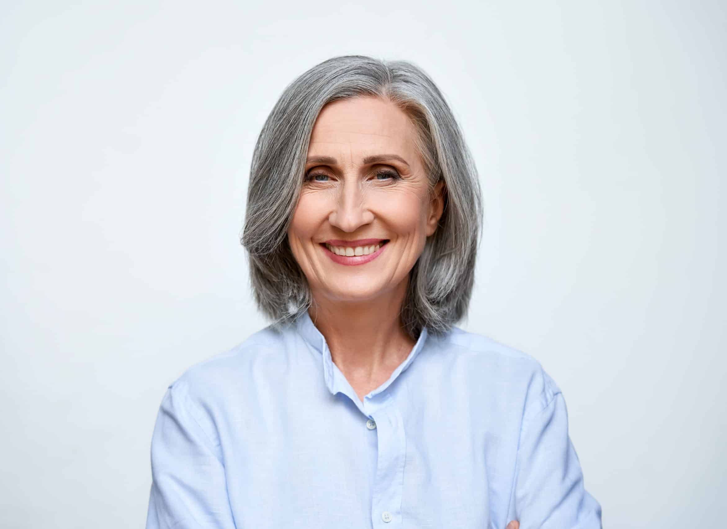 Smiling,Beautiful,Mature,Business,Woman,Standing,Isolated,On,White,Background.
